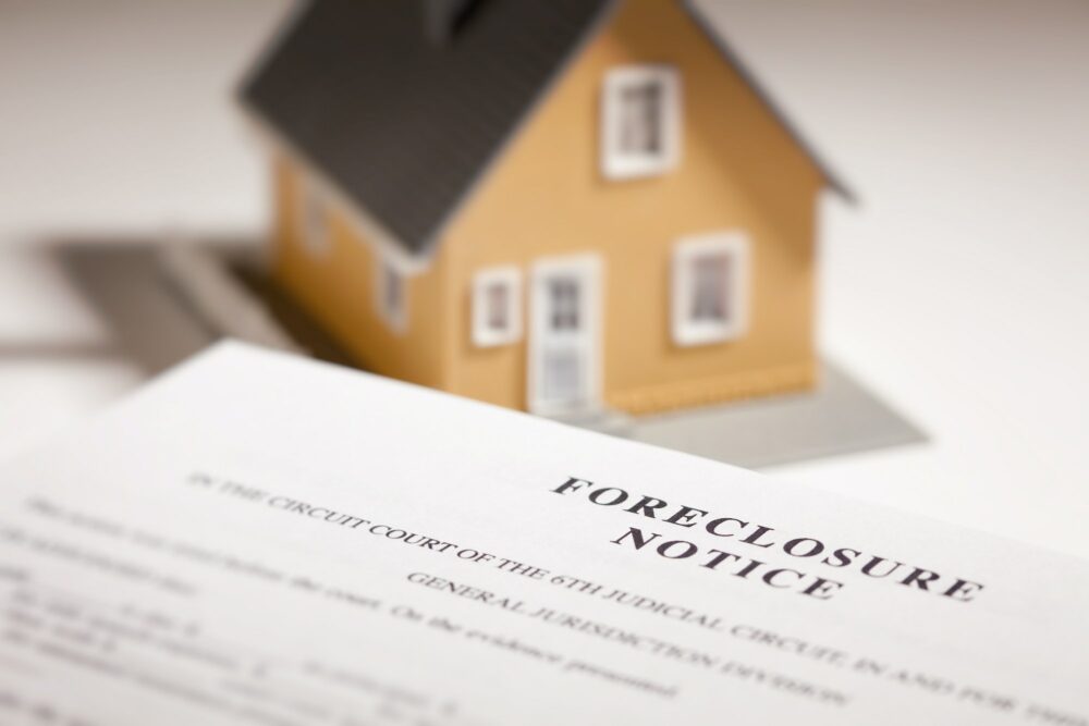 Foreclosure Notice and Model Home on Gradated Background