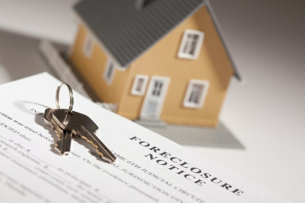 Foreclosure Notice, House Keys and Model Home on Gradated Background
